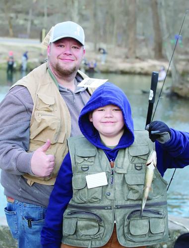 St. Louisans Jeff Piatchek and son, Ryker, 9 fished together opening morning as Ryker reeled in a rainbow. This is his second time fishing at the park.