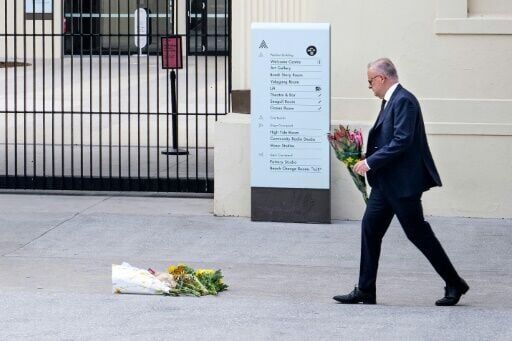 Australia's Prime Minister Anthony Albanese lays flowers at the Bondi Pavillion in Sydney after a mass shooting killed 15 people