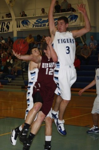 Dustin Sercl goes for a block