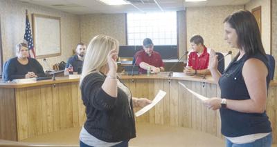 Amanda Duncan (right) being administered the Oath of Office