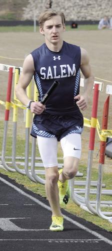 Will Christensen carries the relay baton in the Cuba Invitational earlier this season.