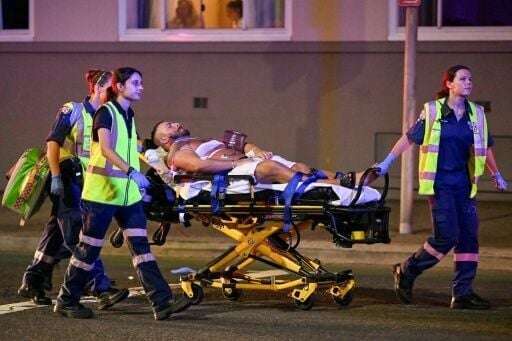 A wounded man is stretchered to hospital after the Bondi Beach shootings