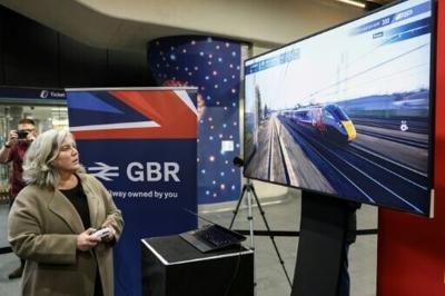 Britain's Transport Secretary Heidi Alexander watches a video game using a train with the new GBR design, during the launch of the Great British Railways (GBR) brand