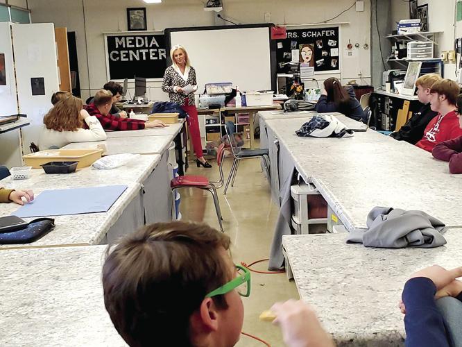 Angie Curley speaking to Salem High School Art Students about "I voted" sticker contest