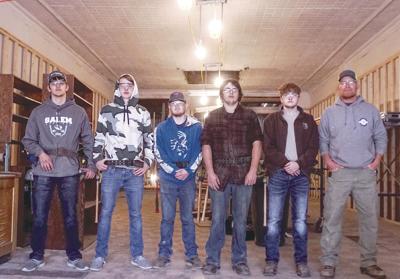 Construction Trades Program Instructor A.J. Tinker and students