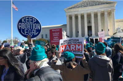 Demonstrators rally before the U.S. Supreme Court