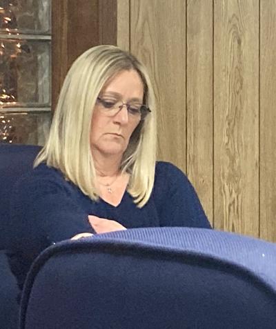 Koller took her place between City Administrator Ray Walden and City Attorney James Weber.