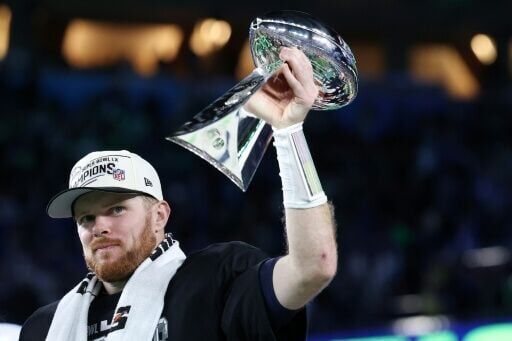 Sam Darnold celebrated with the Vince Lombardi Trophy after winning Super Bowl LX