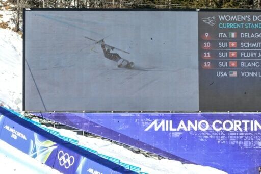 A giant screen shows Lindsey Vonn crashing in the Winter Olympics women's downhill