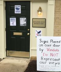 MC Republicans place a sign on their front law disavowing hate signs pasted on their front door 1