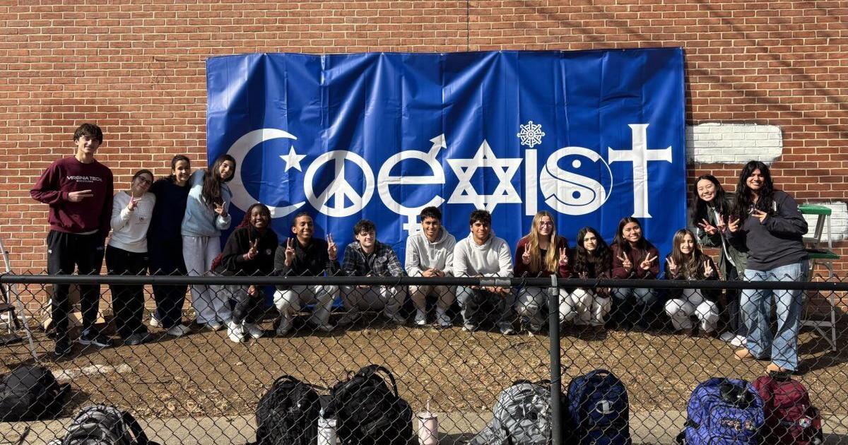 Students display “COEXIST” banner in response to hate graffiti at Whitman