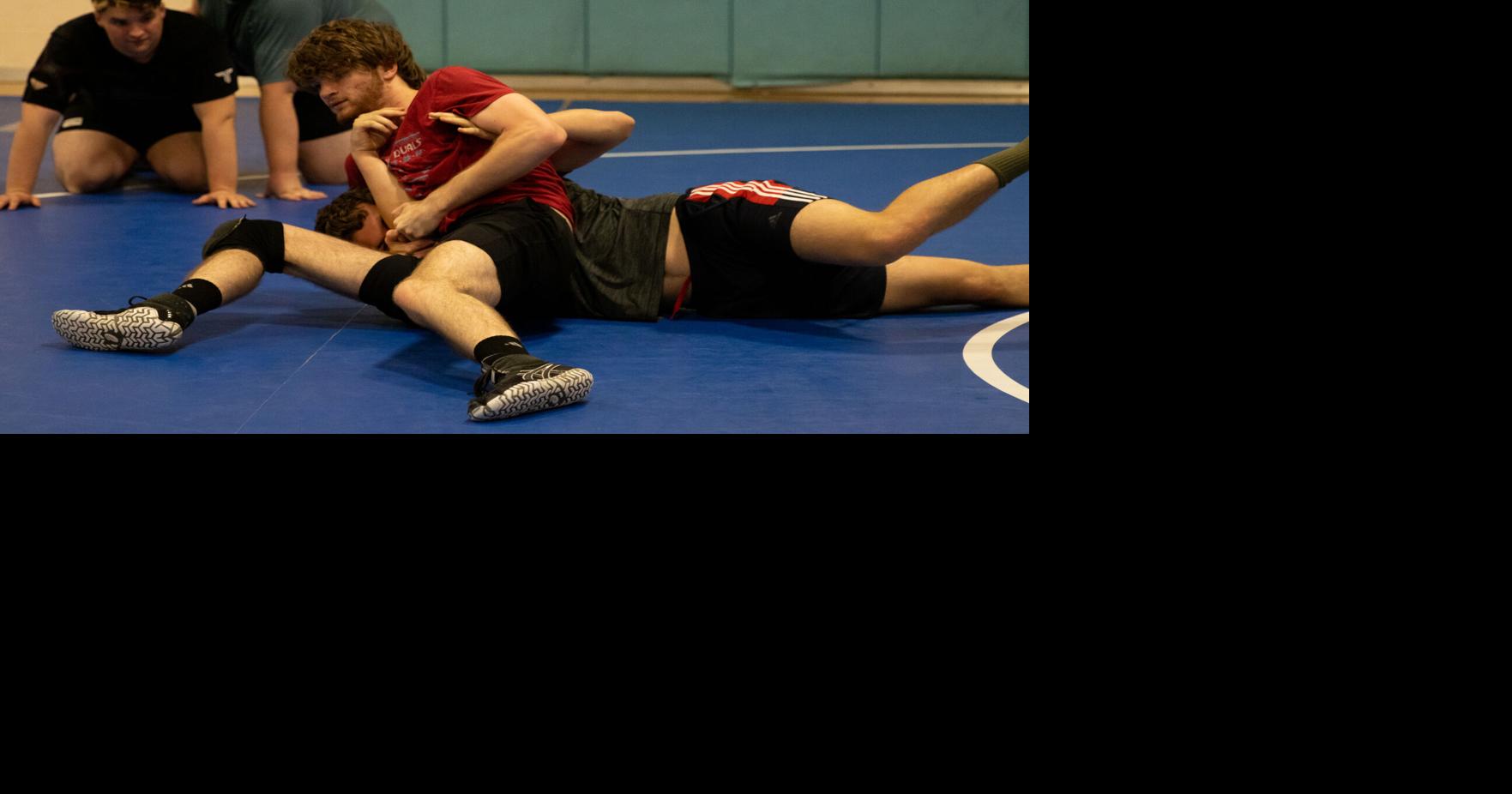 Wrestling club students tap into exercising while tapping out
