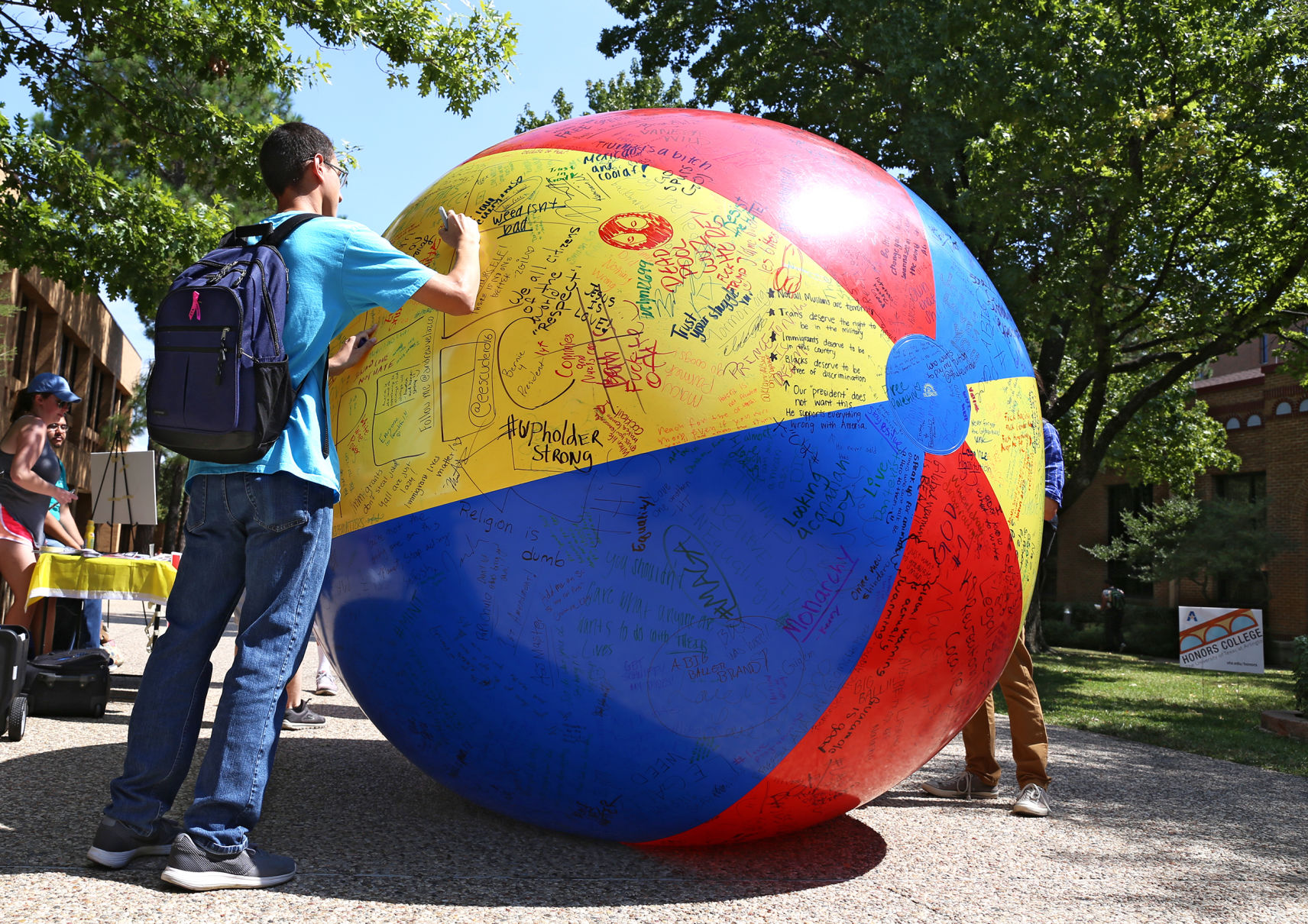 Students write messages on free speech ball Gallery