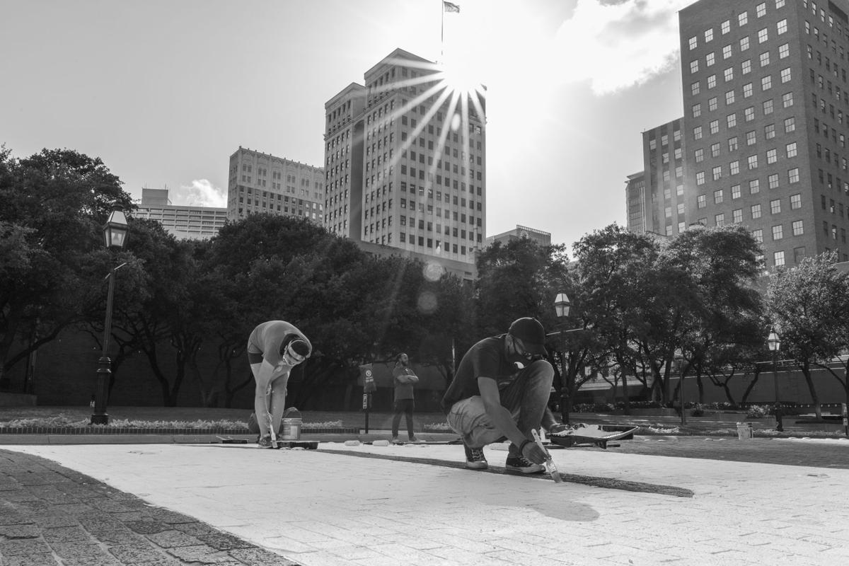 Photos: Volunteers paint 190-foot-wide mural calling to 'End Racism Now' in downtown Fort Worth
