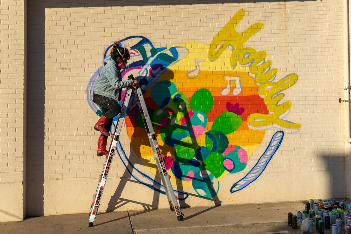 Photos Downtown Arlington commissions spray paint mural for Arlington