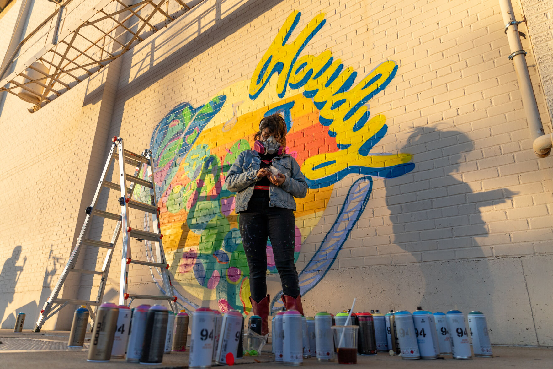 Photos Downtown Arlington commissions spray paint mural for Arlington