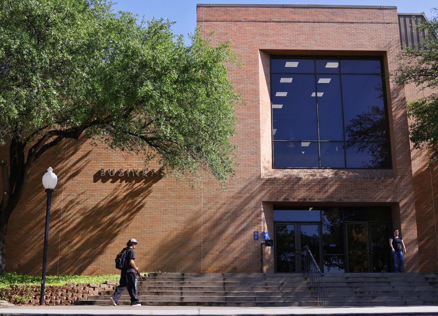 Students walk through the Business Building on April 23