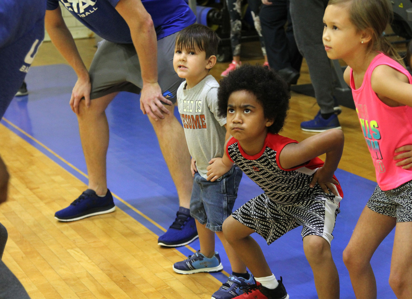 UTA players teach children to play during Hoops for Troops basketball camp