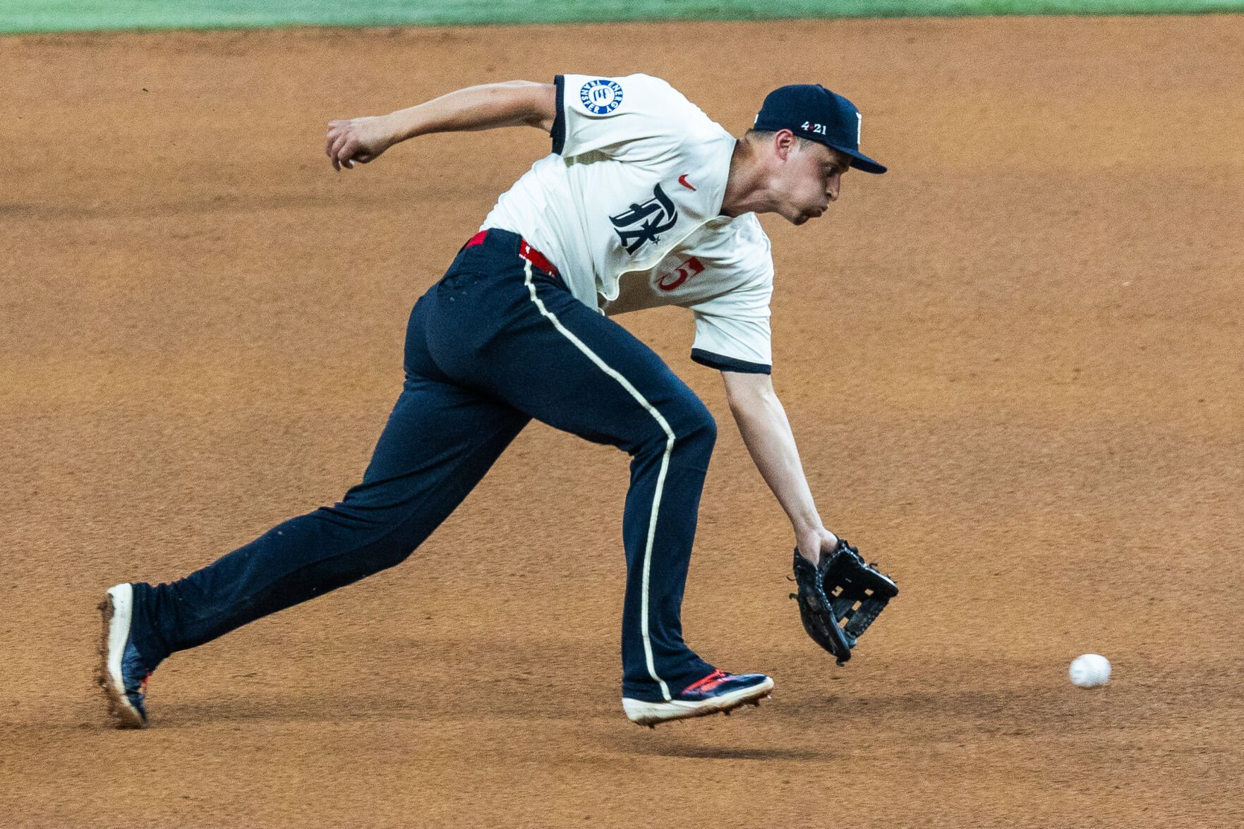 Texas Rangers shortstop Corey Seager reaches for the ball during a game against the Detroit Tigers on July 18 at Globe Life Field. 