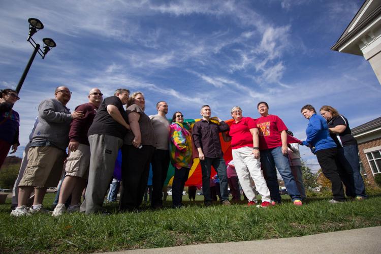 Rights coalition waves 'victory' flag outside clerk's office | Life ...