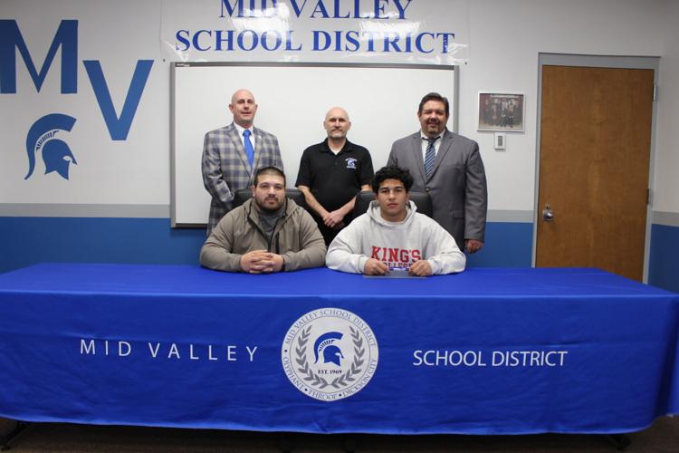 Mid Valley's Devin Ayala has decided to continue his academic career, signing to play football at King's College. Seated from left: Ivan Ayala, father and Devin Ayala. Standing from left: Athletic Director Tom Nowakowski, Head Football Coach Stan Yanosk...