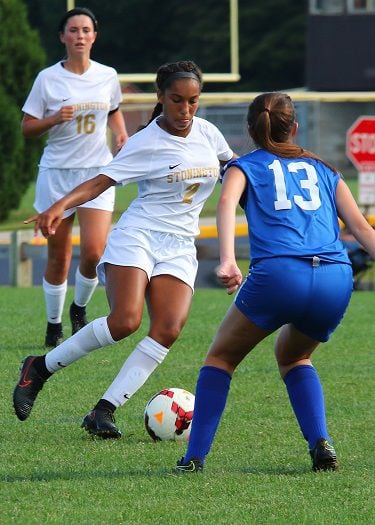 Stonington sophomore midfielder Venessa Benjamin dribbles the ball against a Putnam opponent in the varsity soccer match played Tuesday, September 11th, 2018 at Stonington High School. | Jackie L. Turner, Special to The Sun.