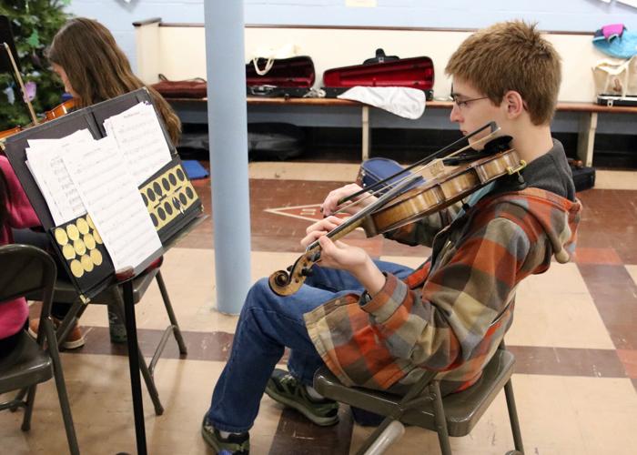 PHOTOS Westminster Youth Strings practicing for its holiday concert