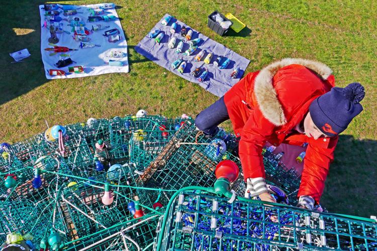 PHOTOS Scaling new heights to hang buoys on the Lobster Trap Tree