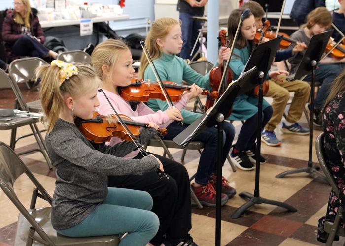 PHOTOS Westminster Youth Strings practicing for its holiday concert