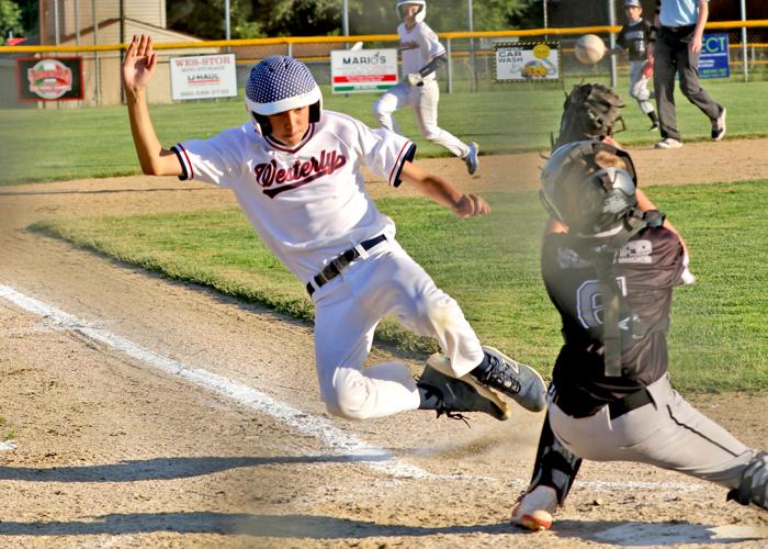 Westerly second baseman Holden Reed (19) starts his slide into home base during the Westerly vs Warwick-North U12 National All-Star baseball game played Sunday evening, June 26, 2022, at the Trombino Sports Complex, Westerly, RI. | Jackie L. Turner, Spe...