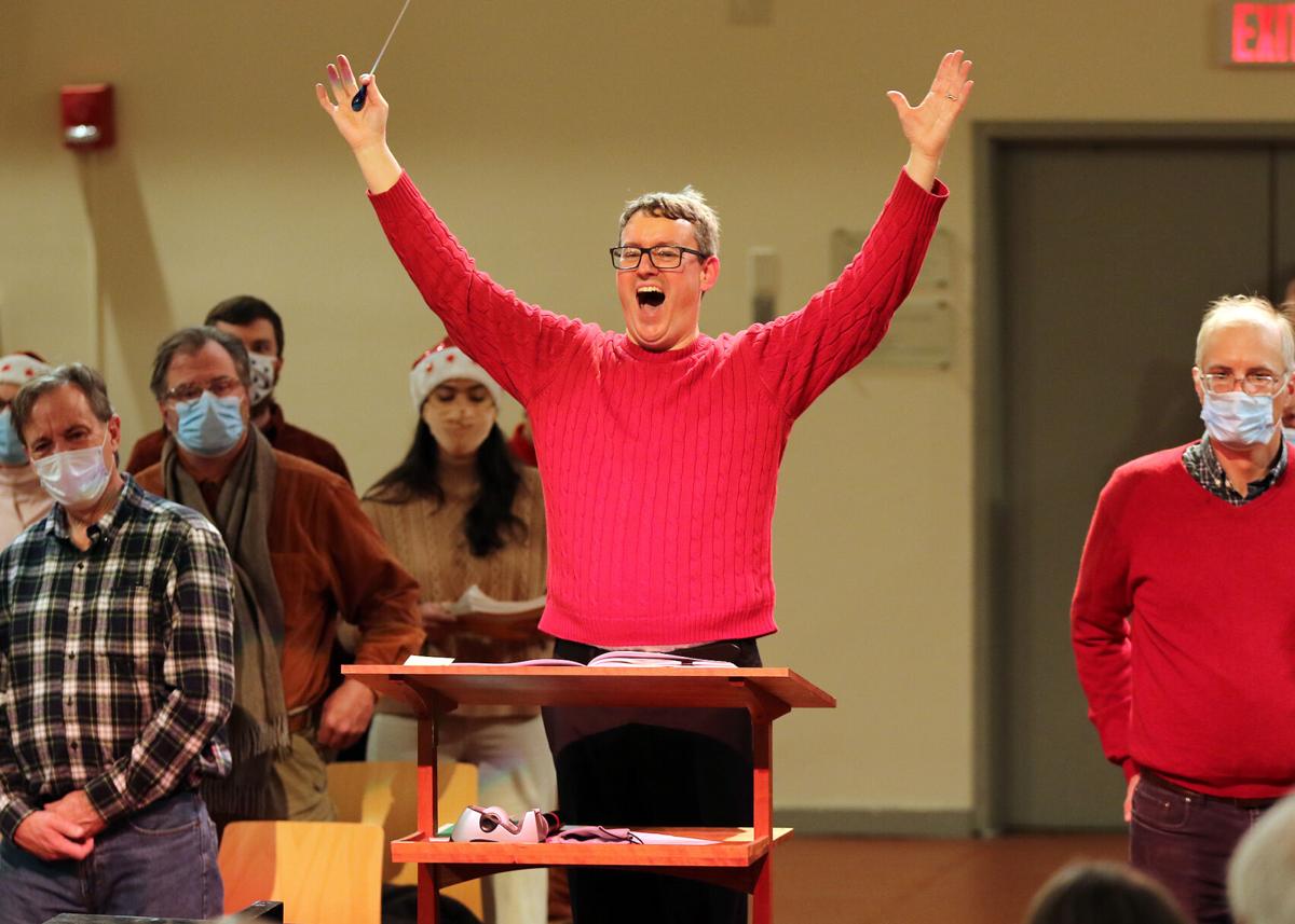 Chorus of Westerly conductor Andrew Howell raises his arms high in recognition of another great evening of Handel’s Messiah and Christmas Carl Sing. The event, cancelled in 2020 due to the COVID-19 pandemic, was held Saturday evening, December 3, 2021 i...