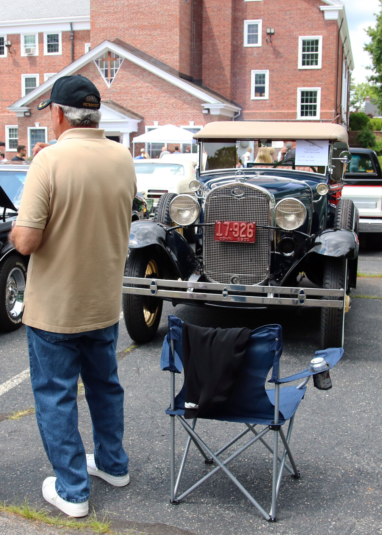 Joe Catalano stands next to his 1931 Ford Deluxe Roadster as he