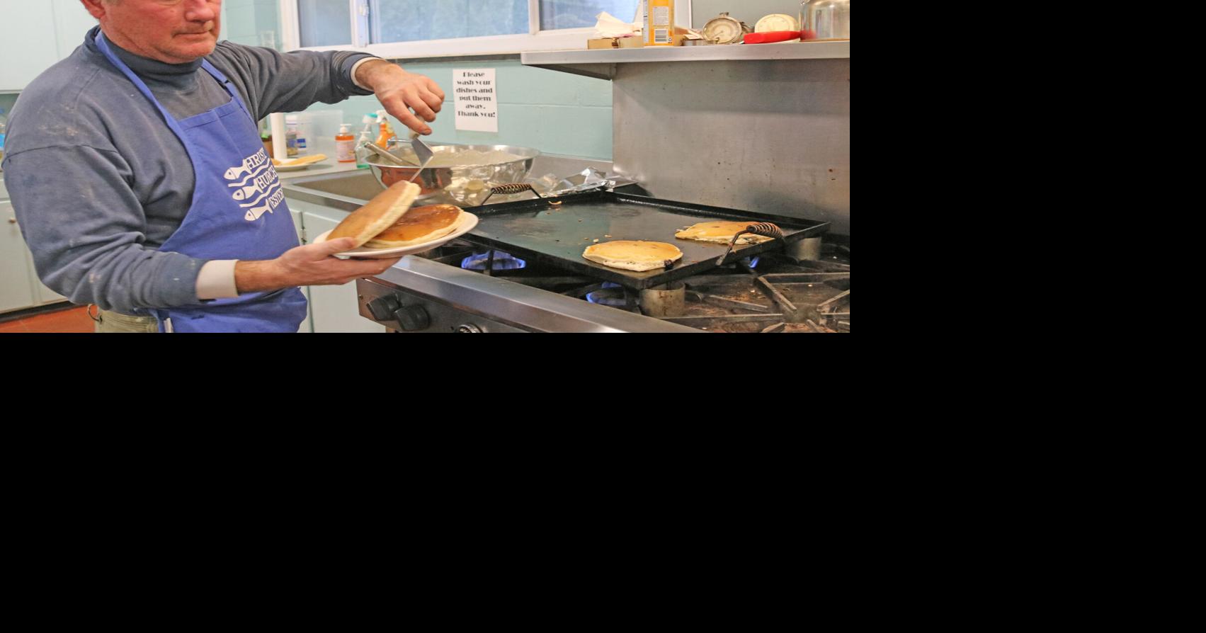 Eric Dunham was busy in the kitchen cooking stacks of pancakes on the ...