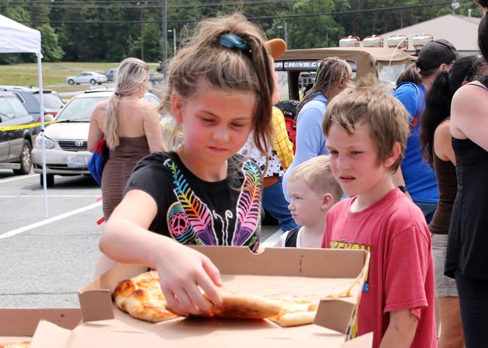 PHOTOS Backpack giveaway at Wireless Zone in Dunn's Corners fun for