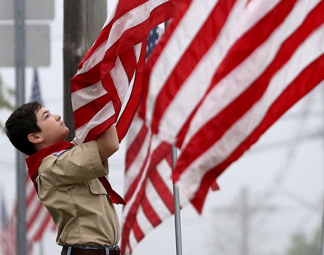 PHOTOS: Scouts help Flag Fund Committee roll out the flags for Memorial ...