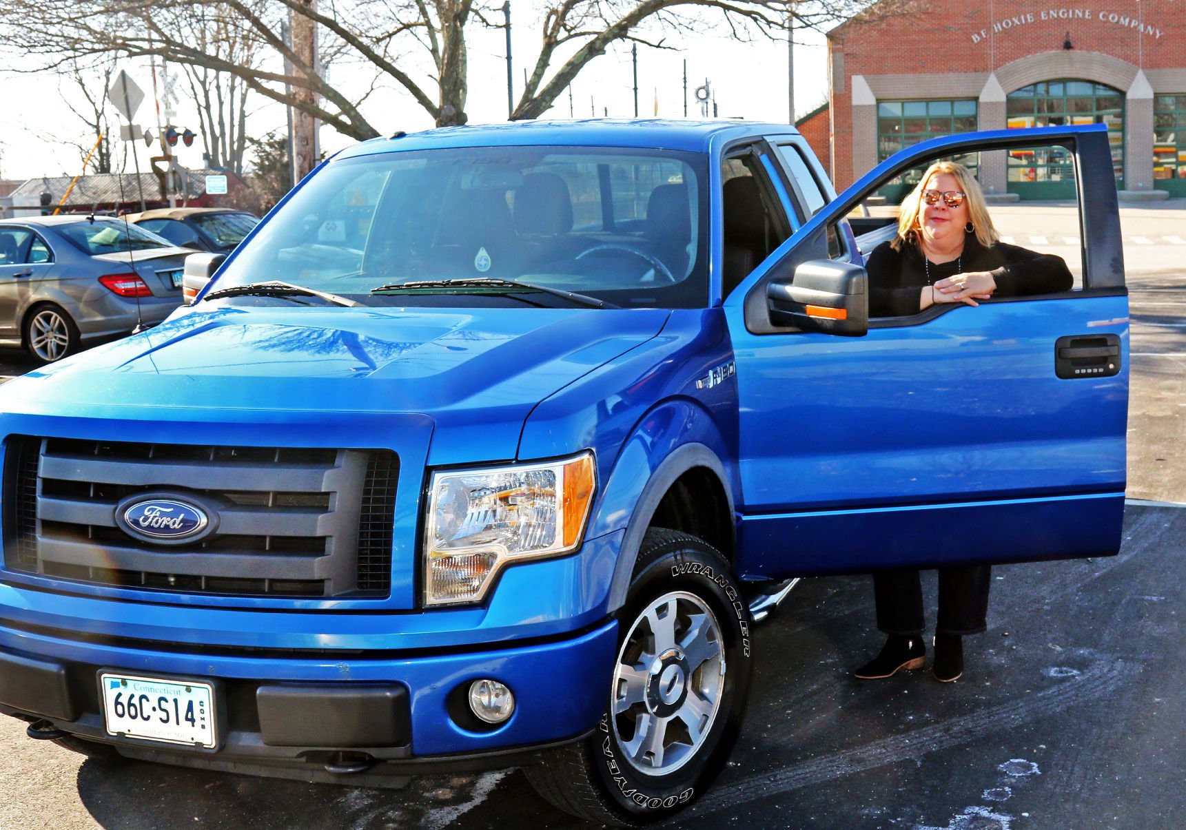 Enjoying the Ride Mystic woman s big blue truck a vehicle for