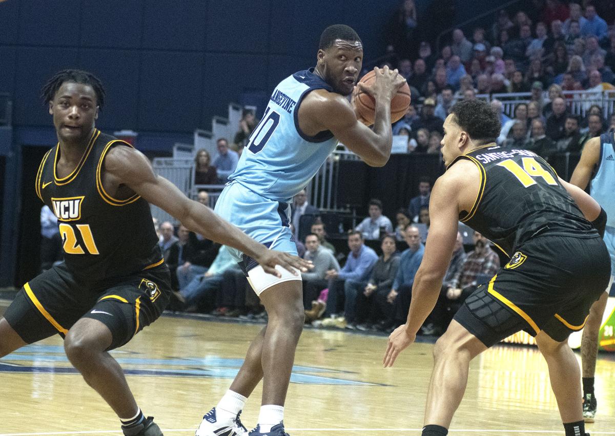 College Basketball Big First Half Carries Rhody Past Vcu Russell