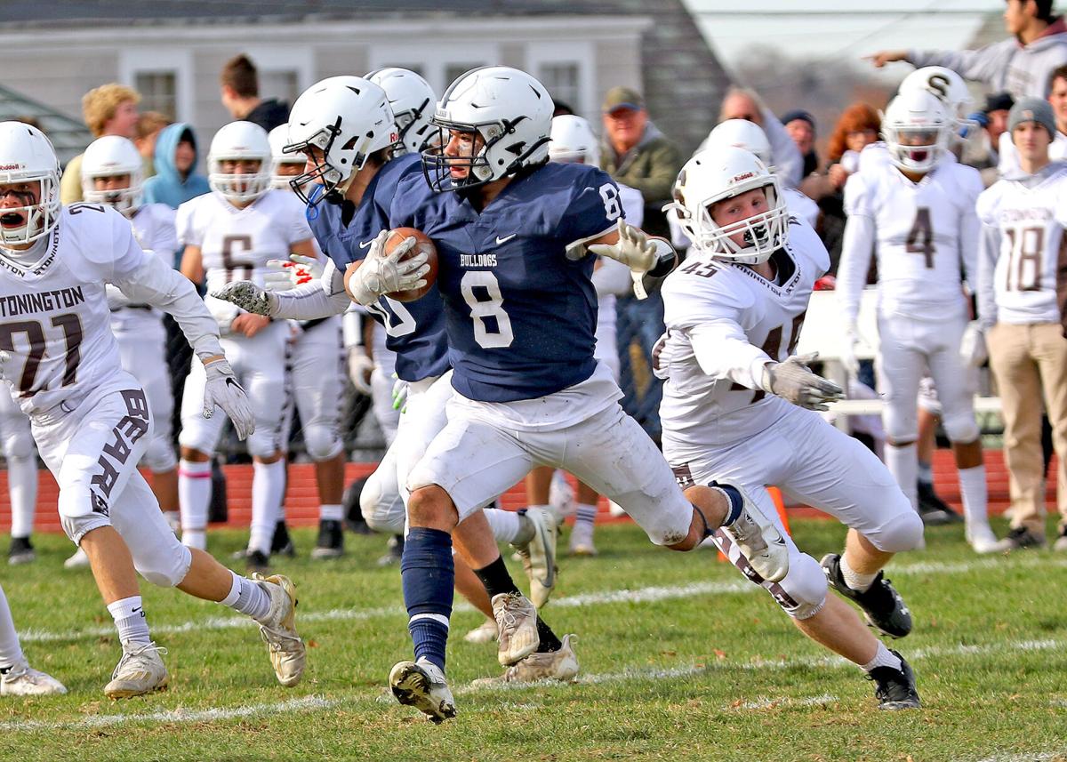 Drew Mason (8) rushes for Westerly during the first half of the annual Westerly vs Stonington Thanksgiving Day football game played Thursday morning, November 25, 2021, at Westerly High School’s Augeri Field.| Jackie L. Turner, Special to The Sun