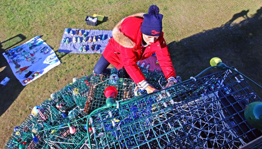 PHOTOS Scaling new heights to hang buoys on the Lobster Trap Tree