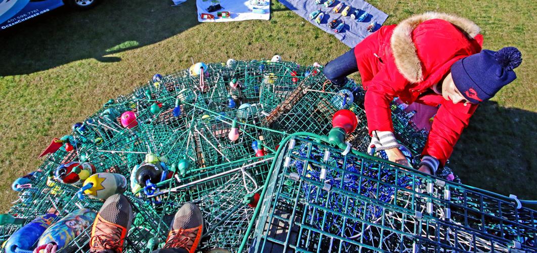 PHOTOS Scaling new heights to hang buoys on the Lobster Trap Tree