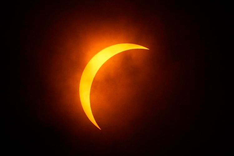 Clouds part for totality as solar eclipse races across U.S. Westerly