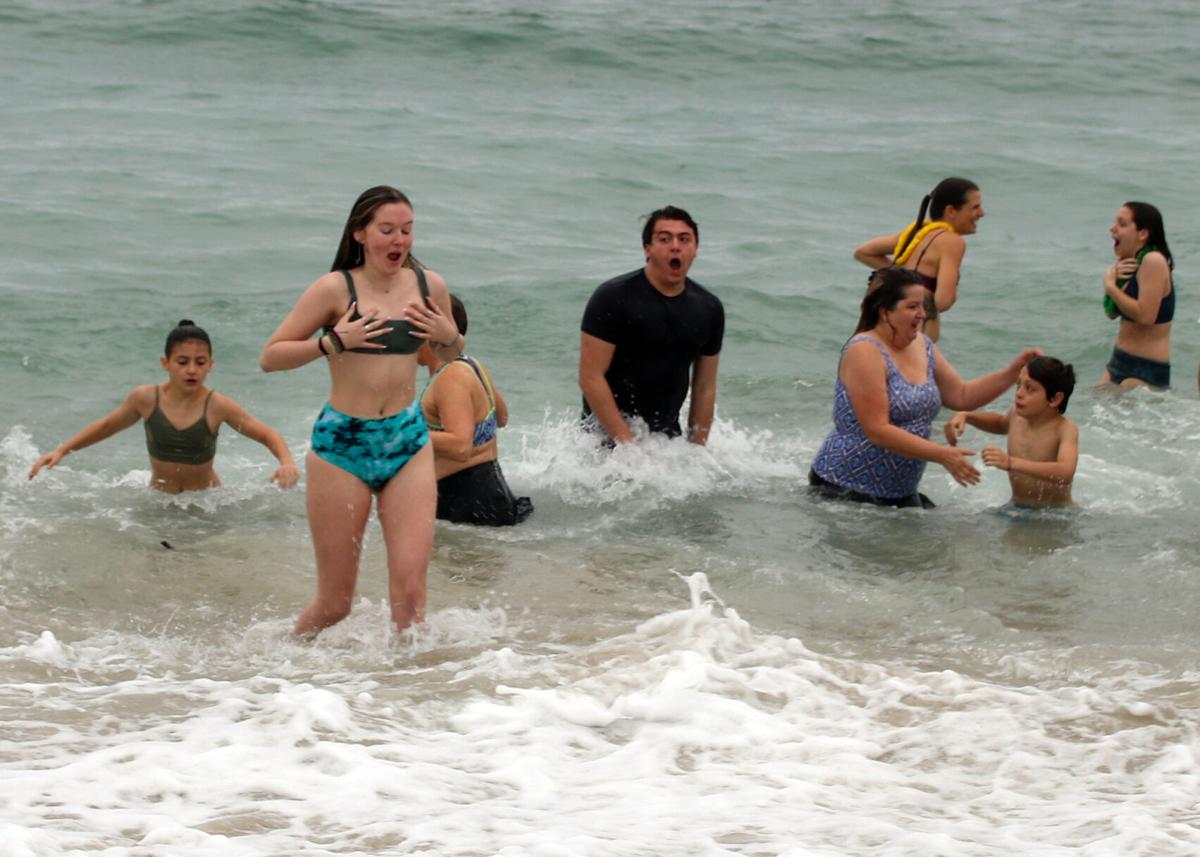 The air temperature may have been 49 degrees but the ocean water temperature took your breath away at a frigid 41 degrees at the 11th Annual RICAN Polar Plunge held at the Charlestown Town Beach in Charlestown, RI on Saturday, January 1, 2022 |Karen Ste...