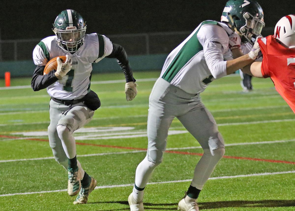 Chariho’s Caleb Maggs (1) carries on a first half punt return in the Chariho Chargers vs Narraganset Mariners EIIL Division-III Championship Title football game played Friday evening, November 19, 2021, at Cranston Stadium, Cranston, RI. Chariho teammat...