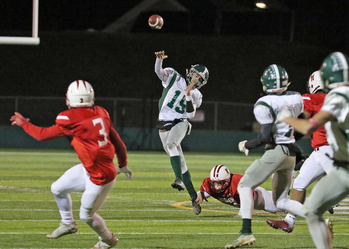 Chariho senior quarterback Zack Bosch (15) throws long during the first half of the Chariho Chargers vs Narraganset Mariners EIIL Division-III Championship Title football game played Friday evening, November 19, 2021, at Cranston Stadium, Cranston, RI. ...