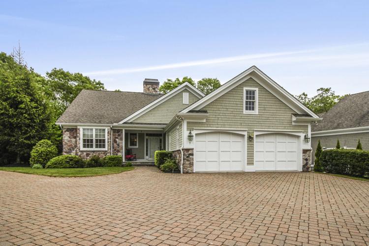 Elegant Winnapaug Cottages condo offers open layout, “treehouse” illusion