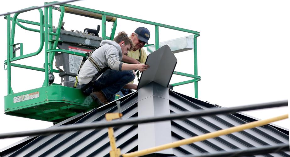 PHOTOS Working the roof at Riverhead Building Supply in Westerly