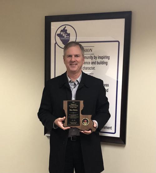 Wes Watts with Region II Superintendent of the Year award