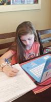 Parents tackle online school with children