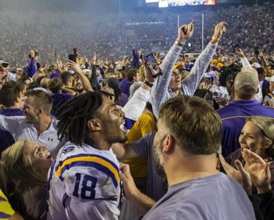 LSU fans storm the field after beating Alabama
