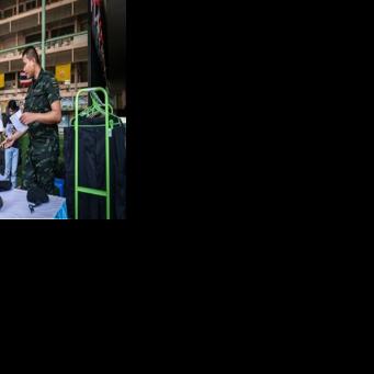 Red or black: Thai men tempt fate at military draft draw